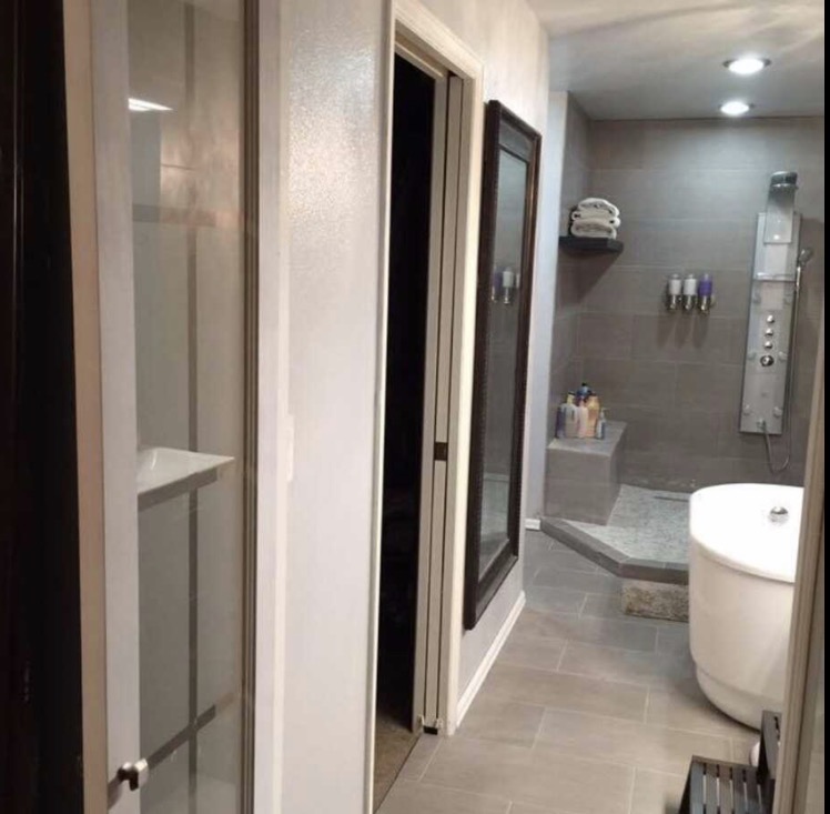 Tiled walk-in shower and soaking tub bathroom remodel