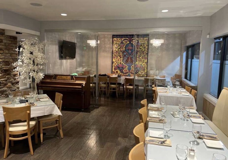 Finished dining room build-out with tile floors and glass partition